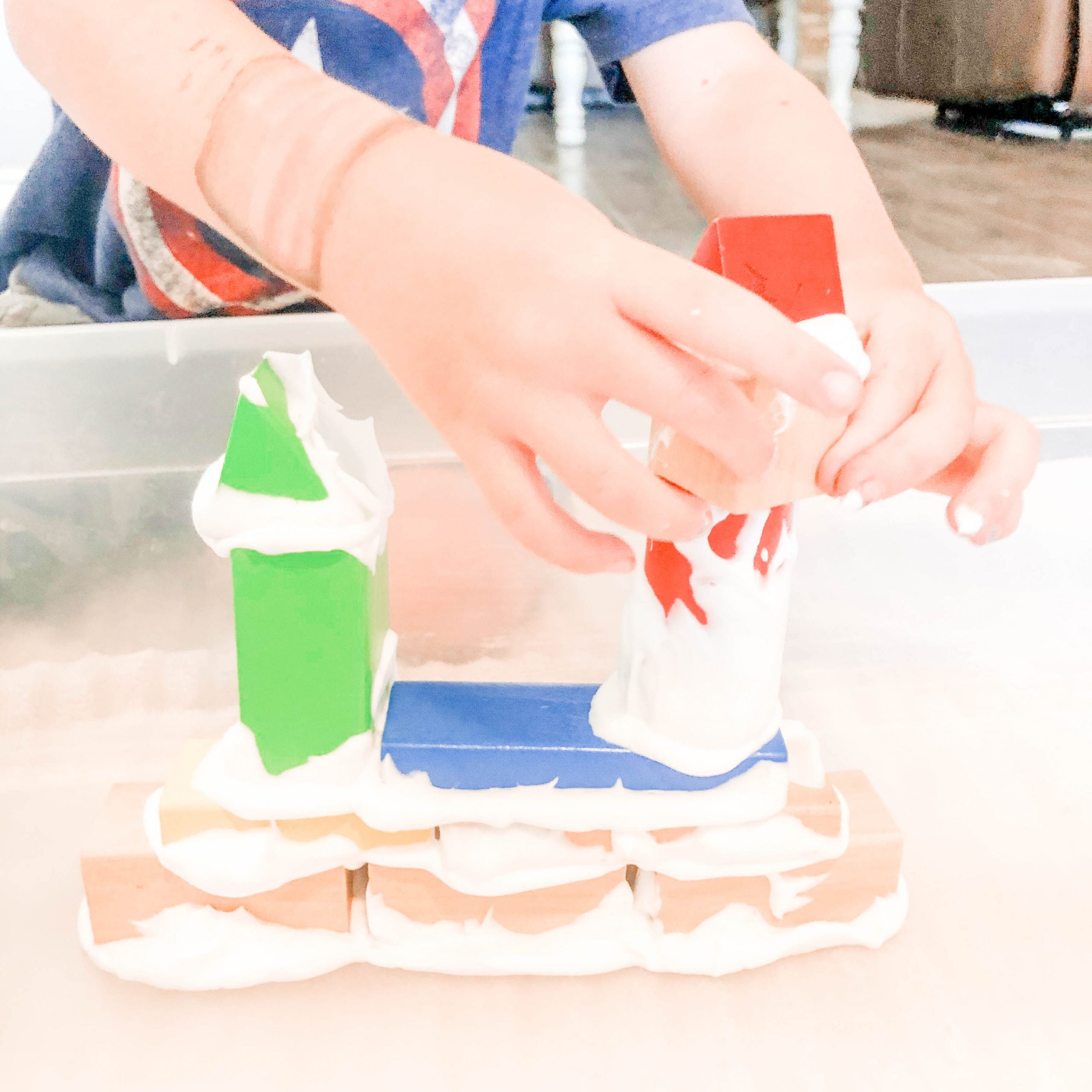 boy building with blocks and shaving cream
